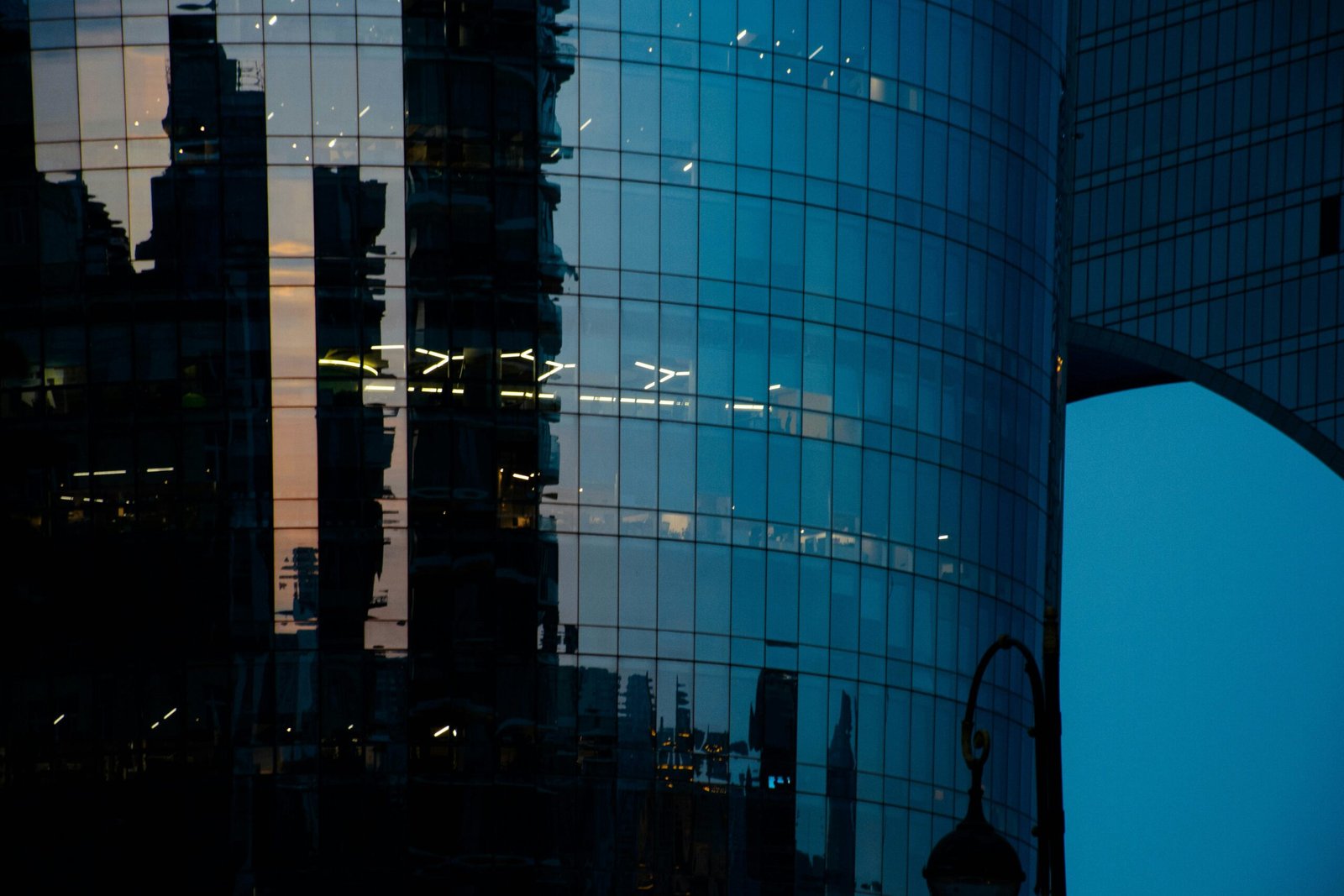 Modern glass architecture reflecting the sky