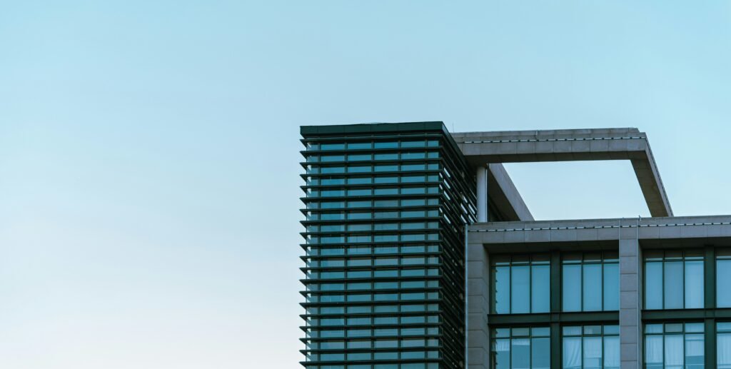 Modern office building with a glass facade and geometric details